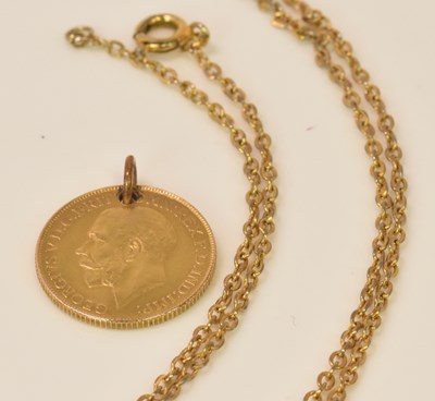 Lot 580 - A fine link chain suspending a George V full...