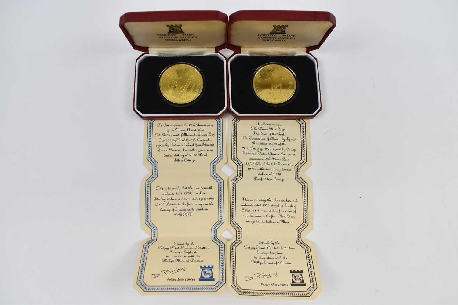 Lot 640 - Two cased Pobjoy Mint silver 100 Patacas coins.