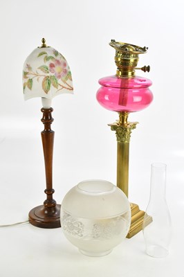 Lot 387 - A 19th century brass and cranberry glass oil...