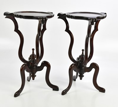 Lot 13 - A pair of decorative mahogany urn stands,...