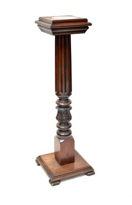 Lot 73 - A carved mahogany jardinière stand with fluted...