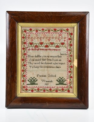 Lot 1314 - A 19th century needlework alphabet sampler, by...