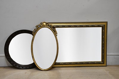 Lot 158 - A 1920s circular oak framed wall mirror,...