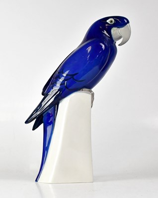 Lot 201 - ROYAL COPENHAGEN; a model of a macaw perched...