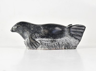 Lot 354 - An Inuit stone carving of a seal, with incised...