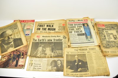 Lot 645 - A collection of tabloid newspapers with...