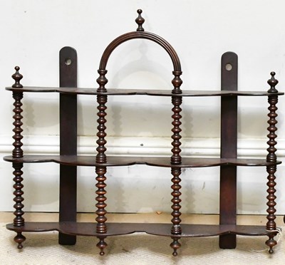 Lot 146 - A 19th century mahogany three-tier wall shelf,...