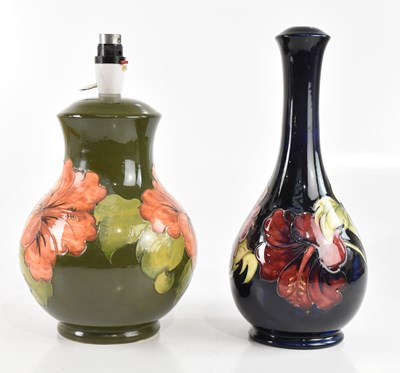 Lot 423 - MOORCROFT; two baluster shaped table lamps in...