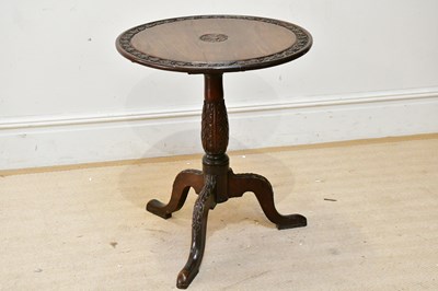 Lot 194 - A 19th century carved oak tilt-top tripod...