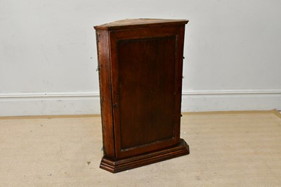 Lot 243 - A 19th century oak hanging corner cupboard,...