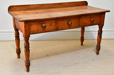 Lot 226 - An old waxed pine three drawer side table, on...