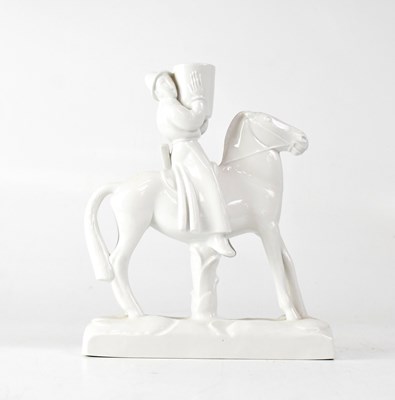 Lot 184 - MEISSEN; a blanc de chine porcelain figure on...