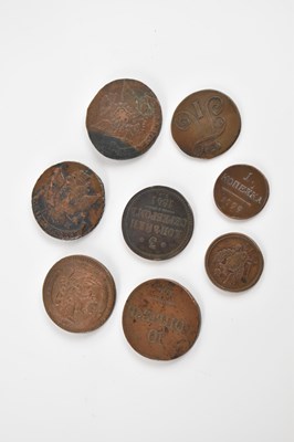 Lot 596 - Eight bronze tokens/coins including a Russian...