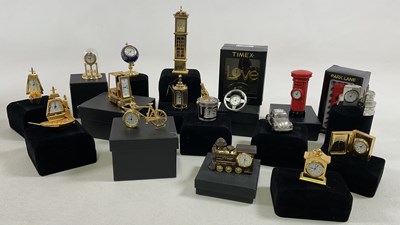 Lot 702 - A quantity of novelty miniature clocks with...