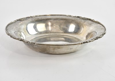 Lot 304 - PRATA; a white metal bowl, with cast scrolling...