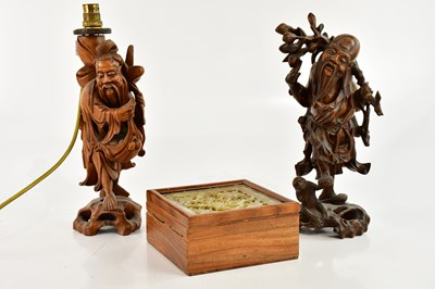 Lot 1105 - Two Chinese carved rootwood figures, one...