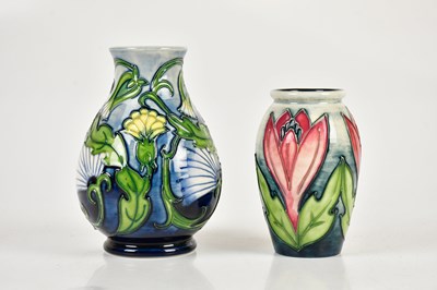 Lot 412 - MOORCROFT; a baluster shaped vase decorated in...