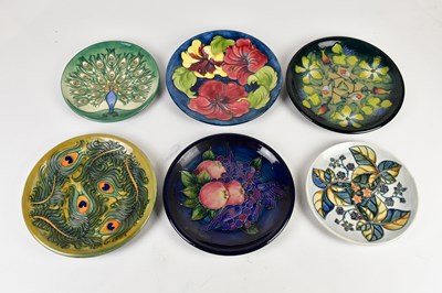 Lot 416 - MOORCROFT; six assorted cabinet plates in...