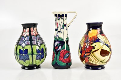 Lot 401 - MOORCROFT; three pieces including a ewer in...