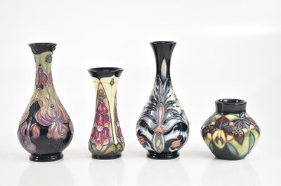 Lot 409 - MOORCROFT; four modern vases including an...