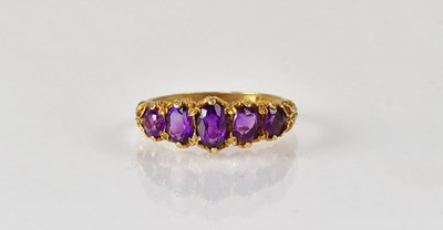 Lot 840 - A 9ct yellow gold ring set with five graduated...