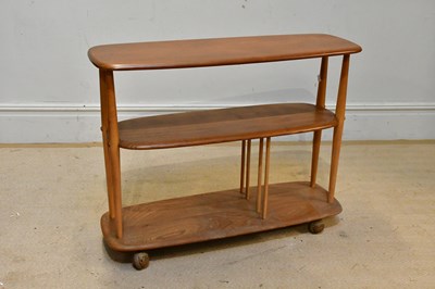 Lot 50 - ERCOL; a three tier drinks trolley/bookcase,...