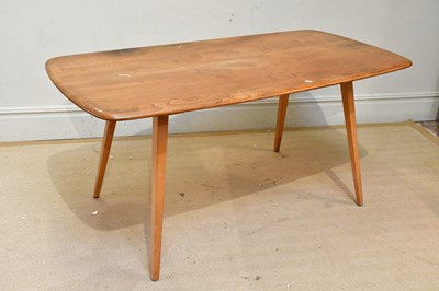 Lot 51 - ERCOL; an elm refectory table on tapering...