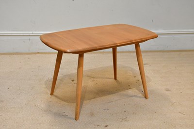 Lot 58 - ERCOL; an elm coffee table on turned column...