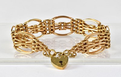 Lot 870 - A 9ct yellow gold fancy gate link bracelet...