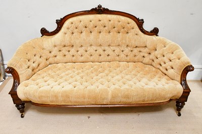 Lot 148 - A Victorian walnut framed settee, upholstered...