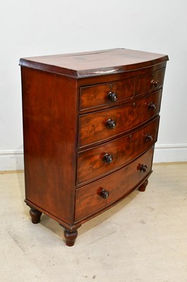 Lot 149 - A 19th century mahogany bowfront chest of two...