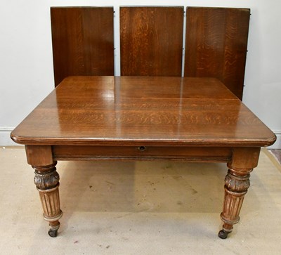 Lot 98 - A late 19th century oak wind-out extending...