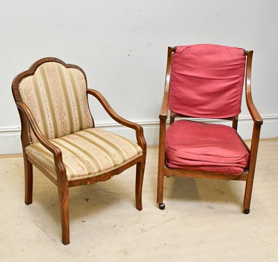 Lot 40 - An oak open sided elbow chair and a similar...