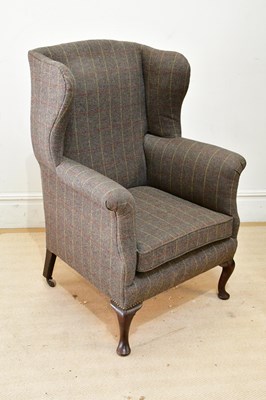 Lot 167 - A wingback armchair, upholstered in a tweed...