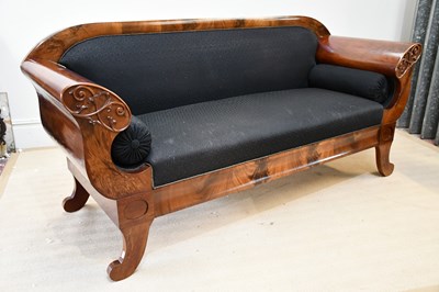 Lot 80 - A Biedermeier style carved flame mahogany sofa,...