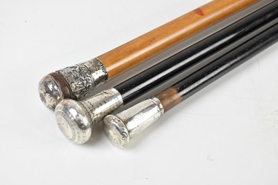 Lot 1255 - Two ebonised walking canes with hallmarked...