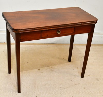 Lot 183 - A late Georgian mahogany foldover tea table,...