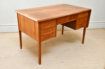 Lot 54 - A mid century Danish teak kneehole desk, with...