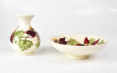 Lot 220 - MOORCROFT; a 'Red Columbine' pattern squat...