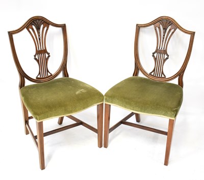 Lot 112 - Four dining chairs comprising a Georgian-style...