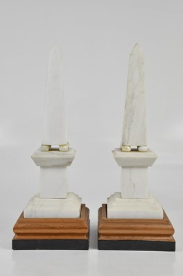 Lot 1234 - A pair of marble obelisks, each on four balls...