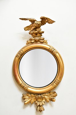 Lot 73 - A Regency style gilt framed convex wall mirror...