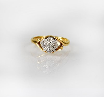 Lot 826 - An 18ct gold ring set with four rose cut...