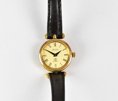 Lot 990 - GUCCI; a 'Stack' wristwatch, the gold-coloured...