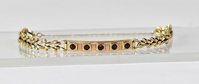 Lot 863 - A 9ct yellow gold bracelet set with five...