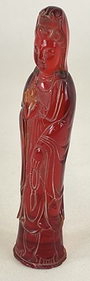 Lot 364 - A Chinese cherry amber coloured figure of...