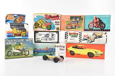 Lot 894 - A collection of ten boxed tinplate toys...