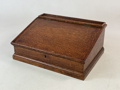 Lot 838 - A 19th century oak table top writing slope...