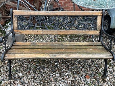 Lot 747 - A garden bench with cast ends and back rest,...