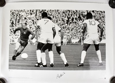 Lot 541 - BOBBY CHARLTON; a black and white poster,...